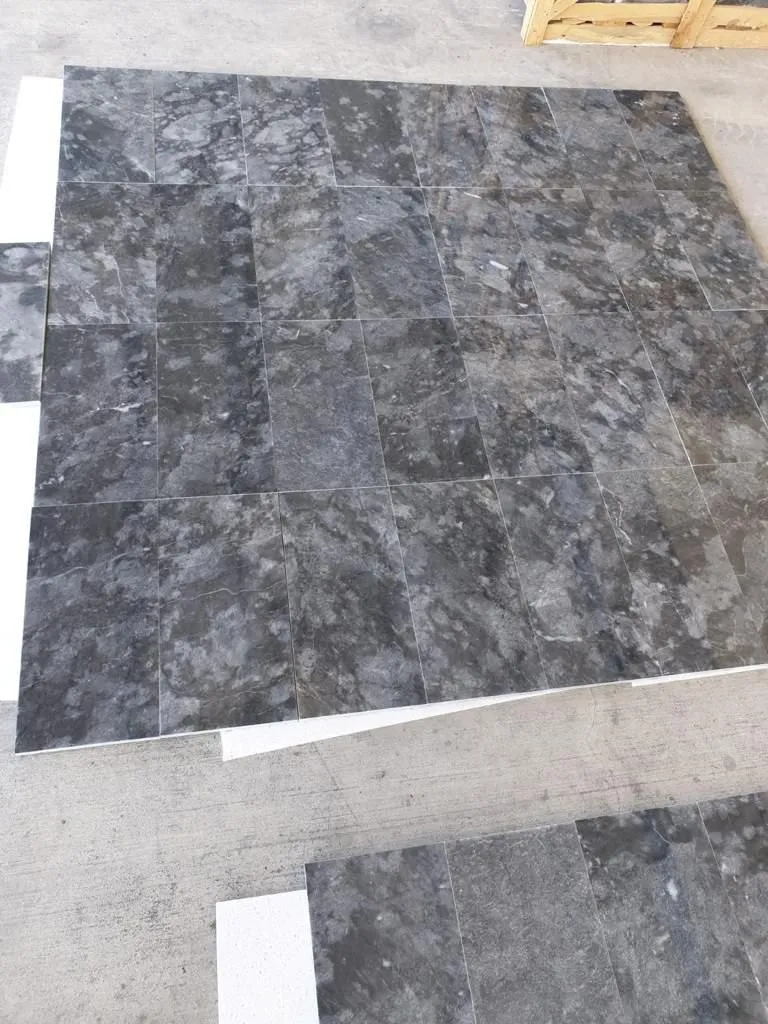 Black marble floor tiles laid out