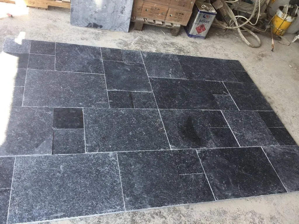 Black marble tiles in a modular pattern
