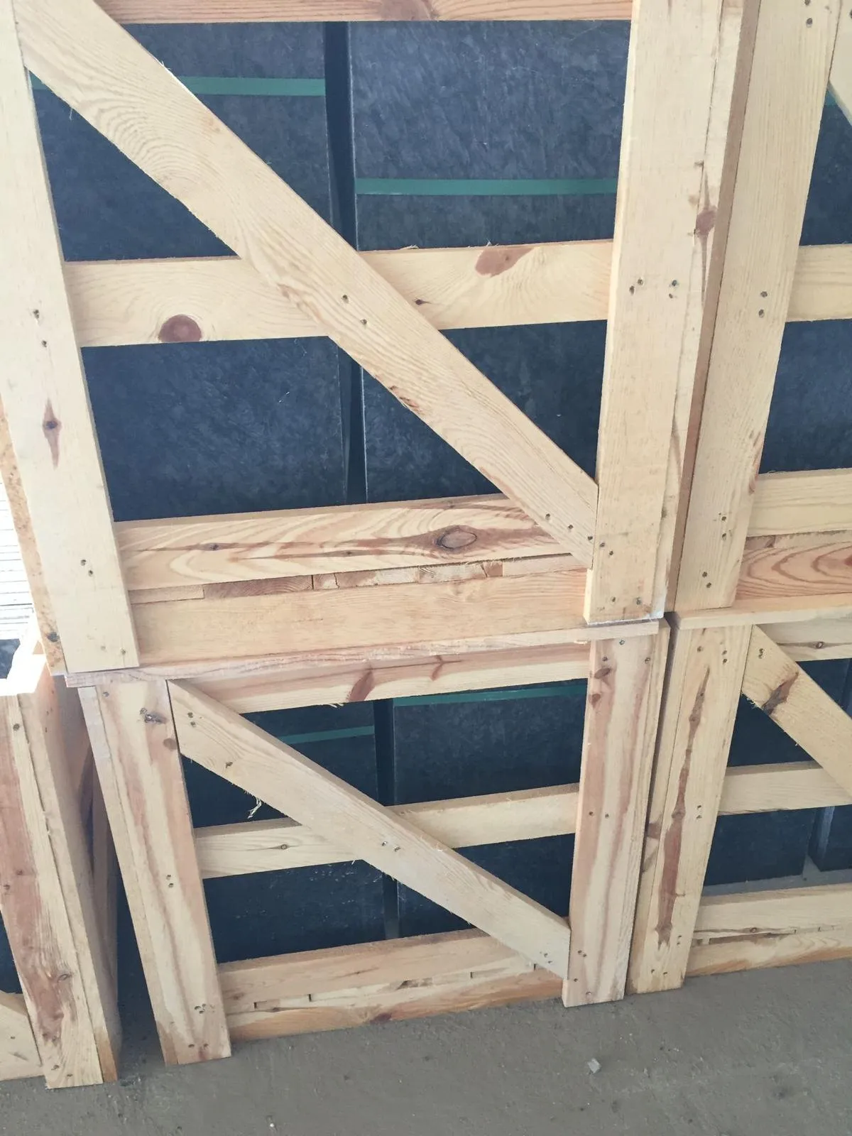 Close-up of a wooden export crate holding marble tiles