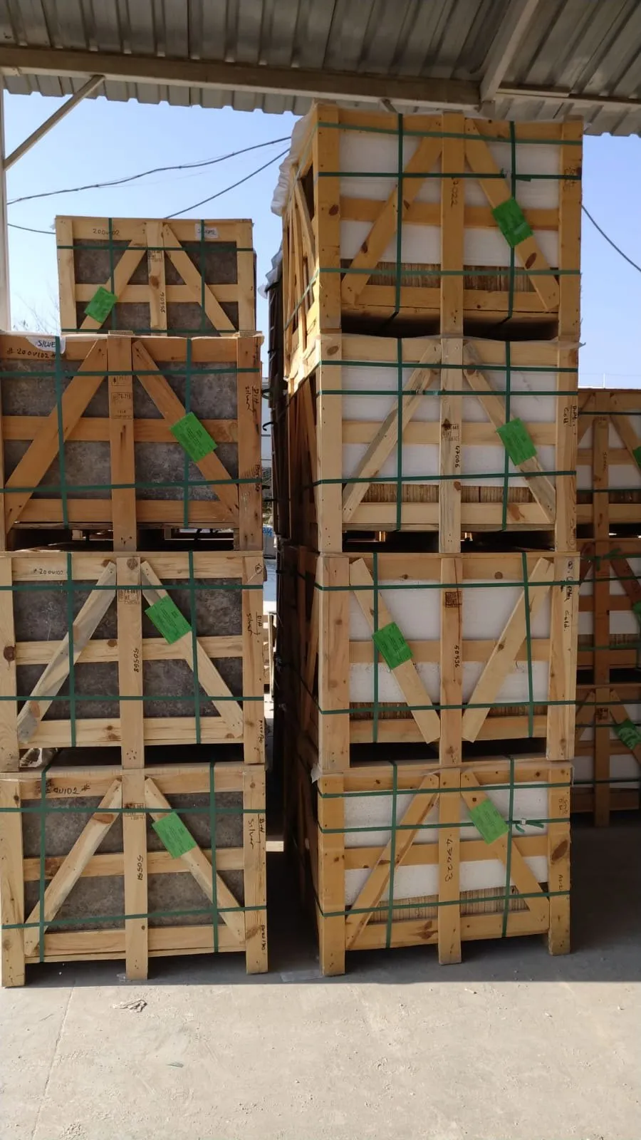 Stacks of labelled travertine crates ready for loading