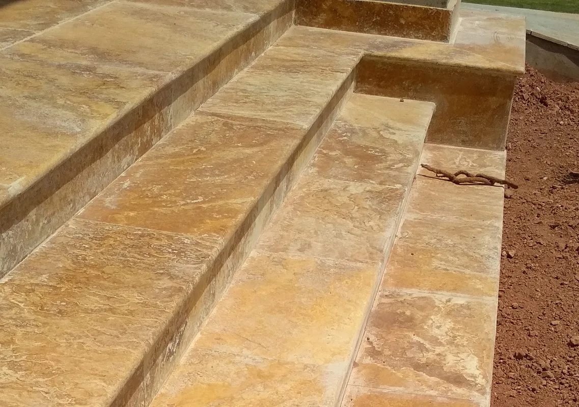 Yellow gold travertine tile surface